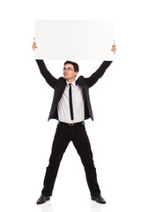 Businessman holding placard over his head.