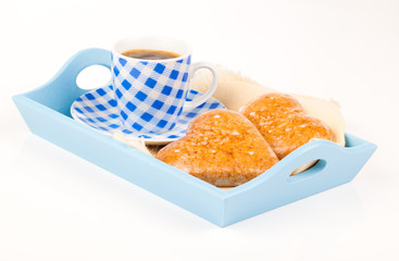 cookies in the shape of heart with coffee cup, in a tray for bre