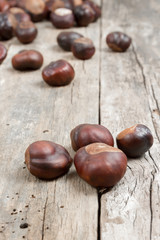 Closeup chestnuts on wooden desk