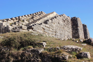 Ancient archaeological site amphitheater or amphitheatre  in Dodoni in Greece with stone seats and steps