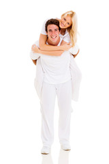 young couple piggyback
