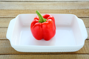fresh pepper in a white  baking dish