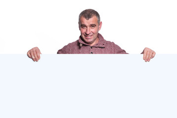 smiling casual old man holding a big blank board