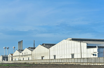 Fototapeta premium Warehouse building with blue sky