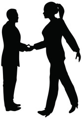 Handshake of business people standing up in silhouette