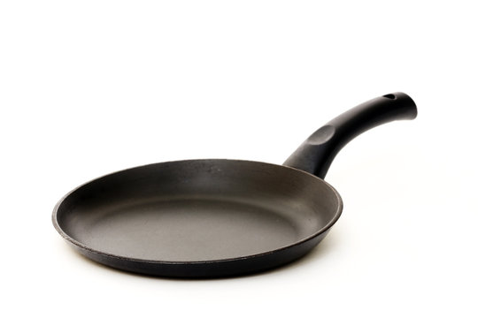Black frying pan isolated on a white background