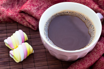 Cup of chocolate on wooden surface