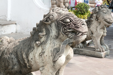 Male chinese stone lion statue