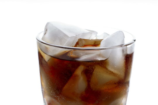Cola with ice in glass