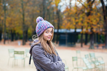 Amused girl in the Gardens of Luxembourg in Paris