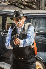 Fototapeta premium Male Gangster Aiming Machine Gun