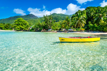 tropical beach with a boat - obrazy, fototapety, plakaty