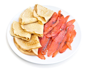 Russian pancakes with red fish - isolated
