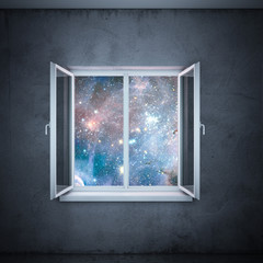 universe in window  (elements furnished by NASA)