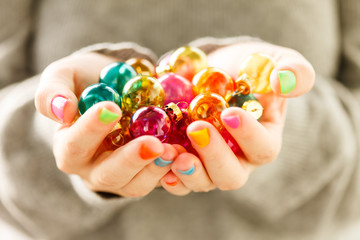 Christmas balls in the hands