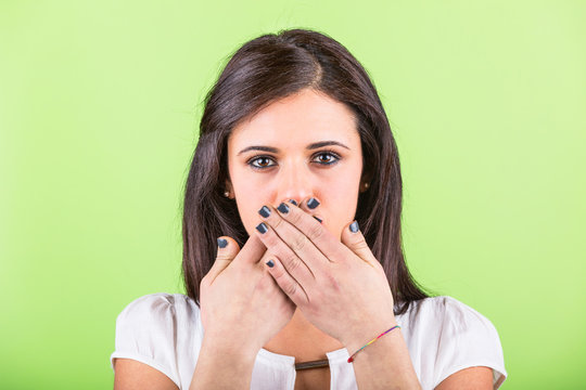 Woman Covering Her Mouth with Hands