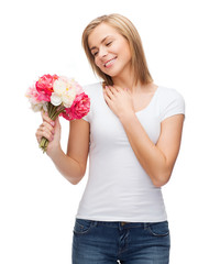 smiling woman with bouquet of flowers