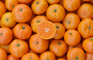 Crate of ripe tangerines.