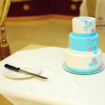 White And Blue Wedding Cake On Table