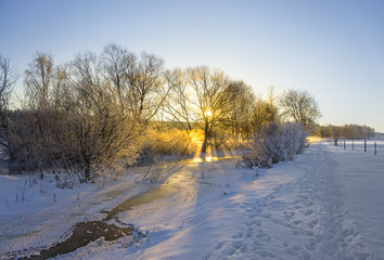 Obraz na płótnie Canvas frozen river in winter landscape