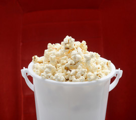 popcorn bucket made of plastic over red background