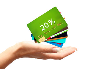 Woman hand with credit, discount cards isolated on white