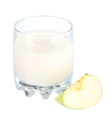 Delicious yogurt in glass with apple isolated on white