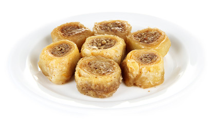 Sweet baklava on plate isolated on white