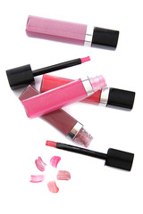 Obraz premium Beautiful lip glosses, isolated on white