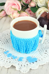 Cup with knitted thing on it close up