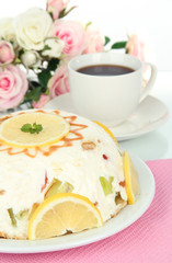 Delicious jelly cake on table on white background