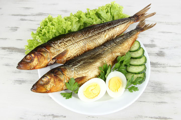 Smoked fish on plate close up