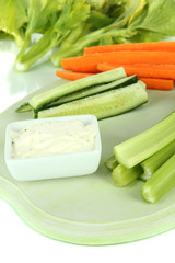 Fresh green celery on cutting board close-up