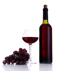 Wineglass with red wine, grape and bottle isolated on white