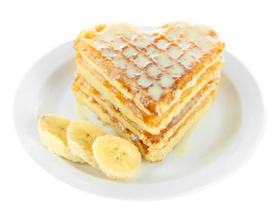 Sweet Belgium waffles with banana, isolated on white