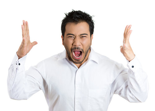 Angry, mad, frustrated young man screaming at someone