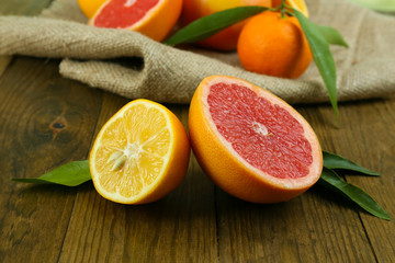 Lots ripe citrus on wooden background