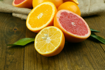 Lots ripe citrus on wooden background