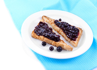 Delicious toast with jam on plate close-up