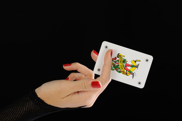 Beautiful woman hand with gamble card jolly joker