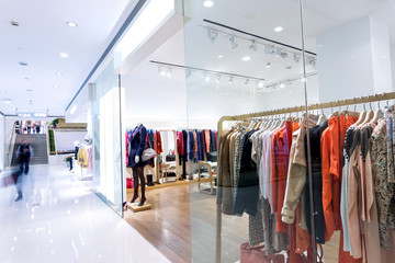 Boutique display window with mannequins in fashionable dresses