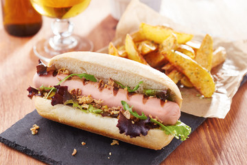 Gourmet hot dog on slate board