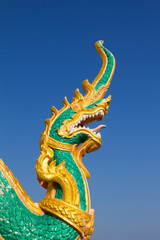Fototapeta na wymiar Typical traditional dragon sculpture at Wat Plai Laem temple