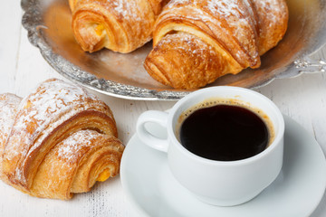 Coffee with fresh croissants