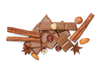 Chocolate bar with spices and nuts isolated on white