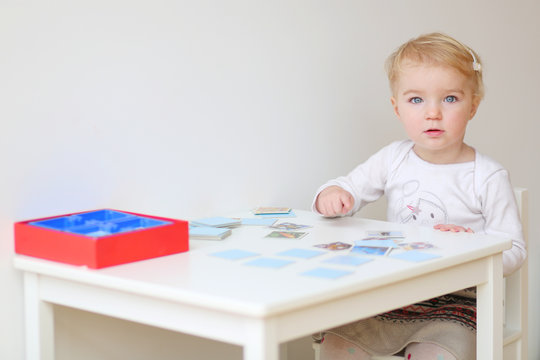 Adorable Blonde Toddler Girl Playing Memory Game