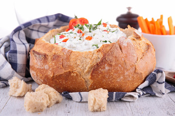 bread bowl with cheese and vegetables