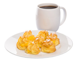 Homemade cream puff and a mug of coffee