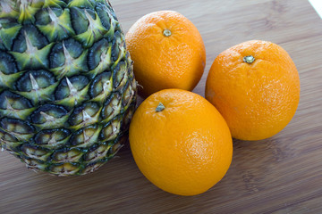 pineaple on wood table in white background
