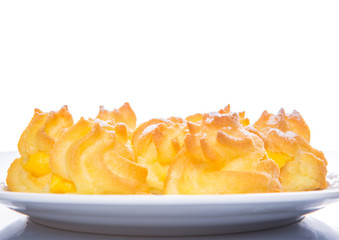 Home made cream puff on a white background